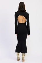 Black long-sleeve dress with cut-out back worn by a model on a white background